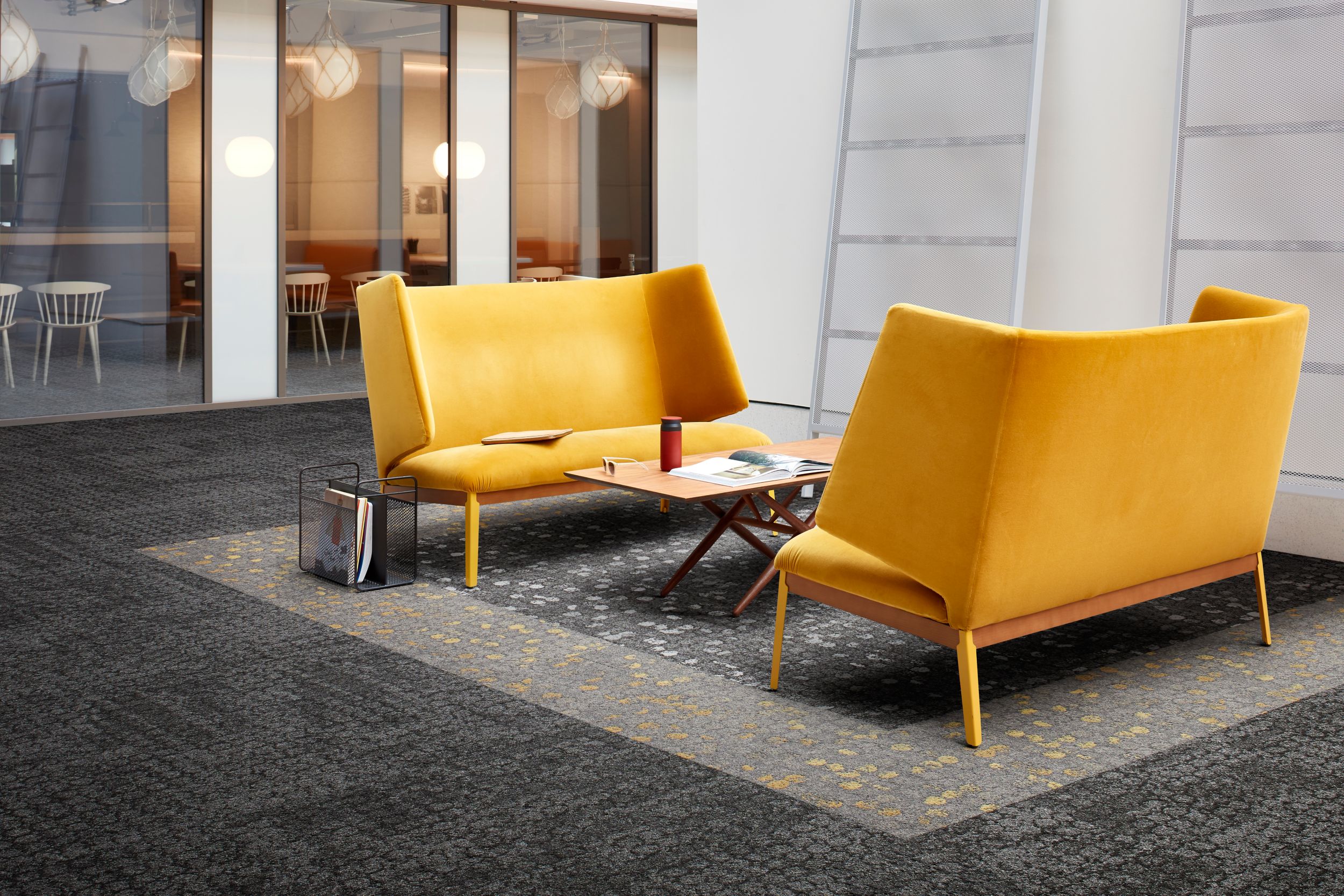 Interface Mercer Street and Broome Street carpet tile in seating area with two yellow couches image number 11